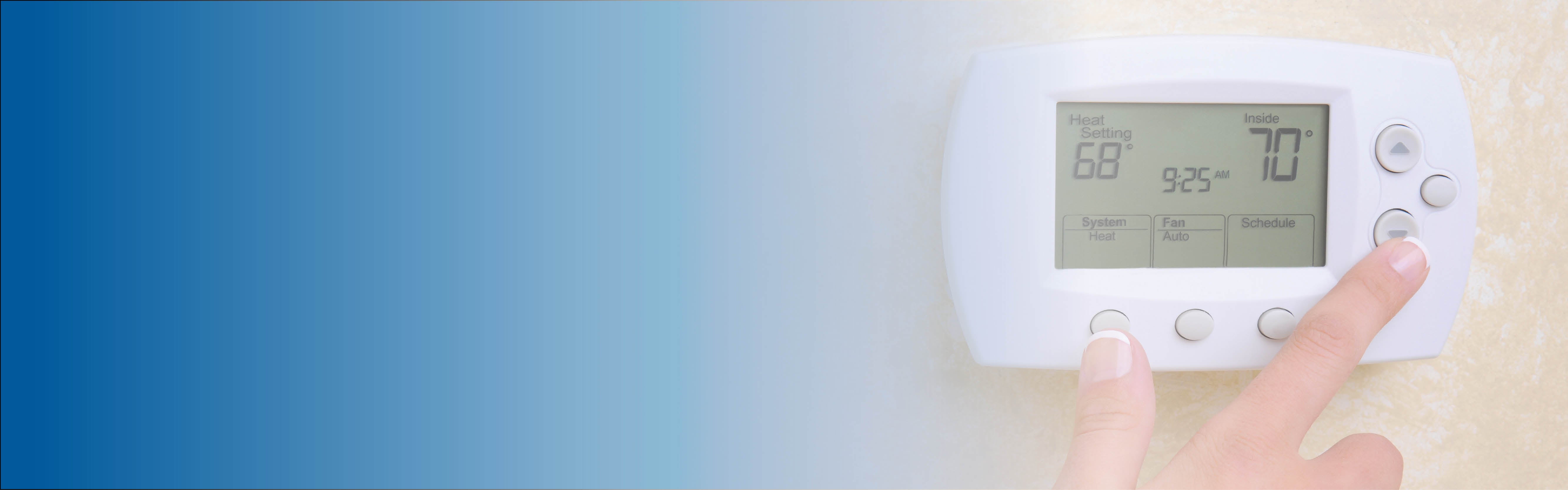 A woman turns down her thermostat to 68 degrees to conserve energy
