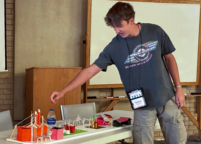 Campers divide into teams and create a model of the electric cooperative and how power travels from creation to end user
